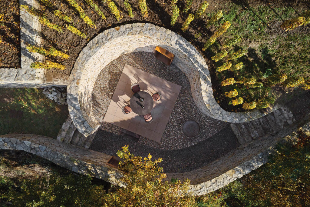 an aerial view of the curving stoned terrace at a winery