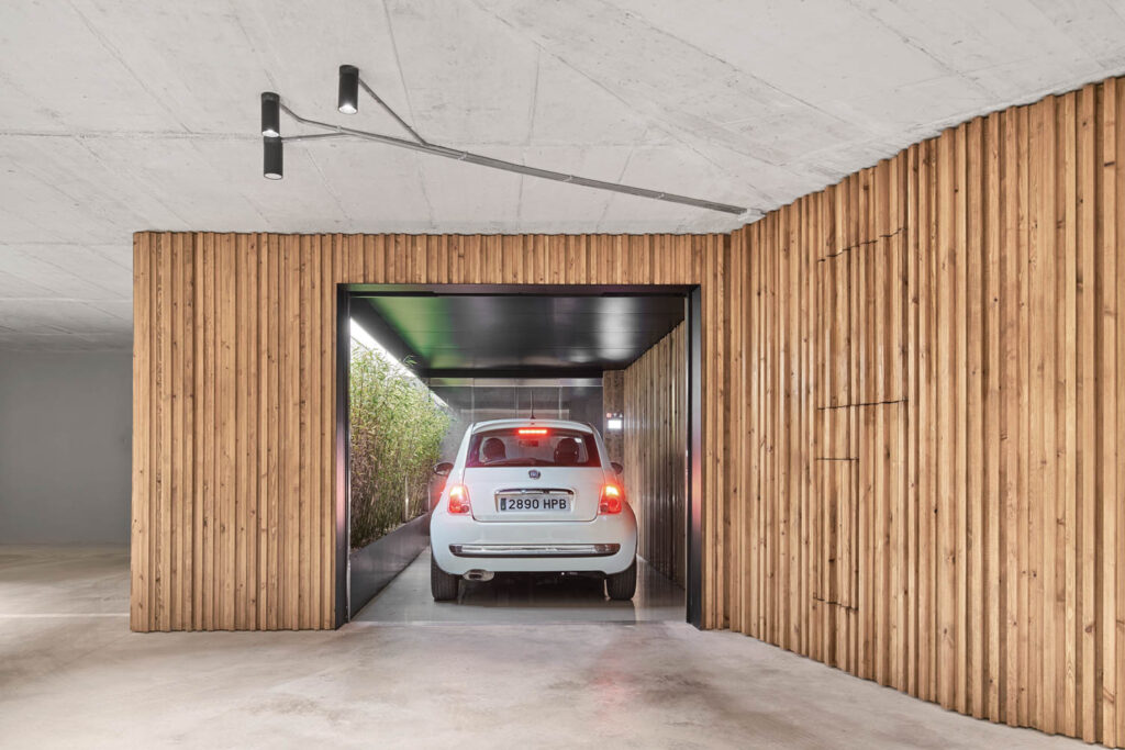 an elevator lifting a car in a garage