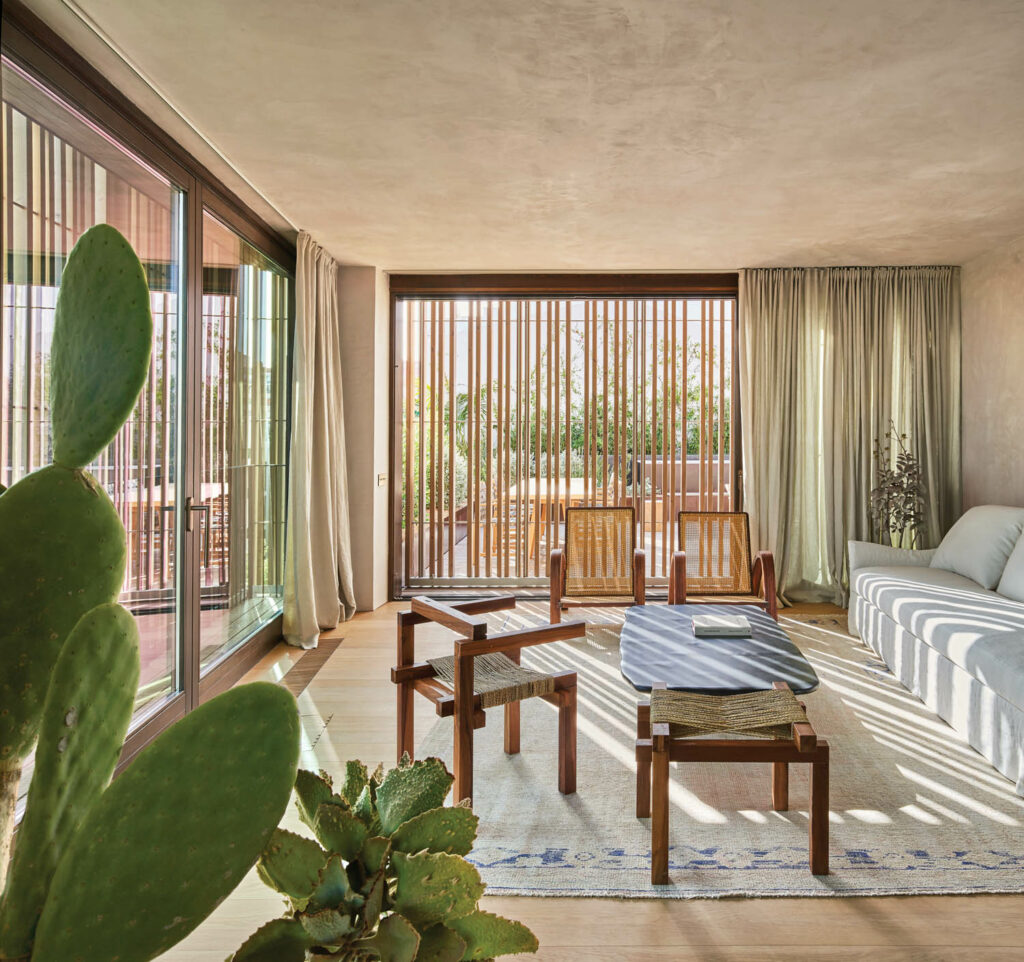 the living room in a triplex decorated with natural materials