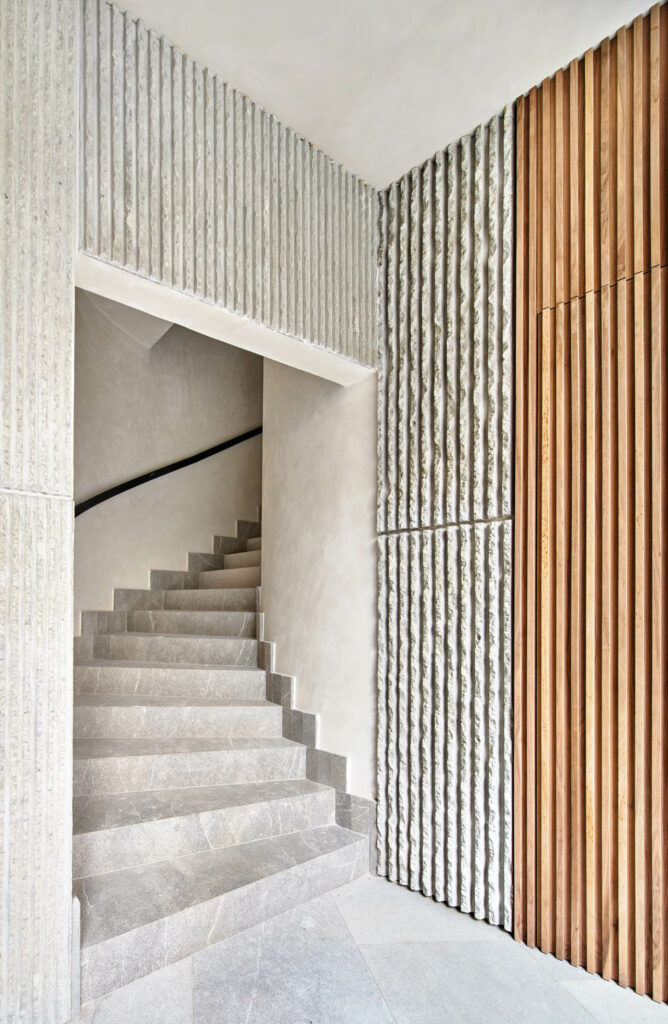 a Spanish marble staircase inside an apartment