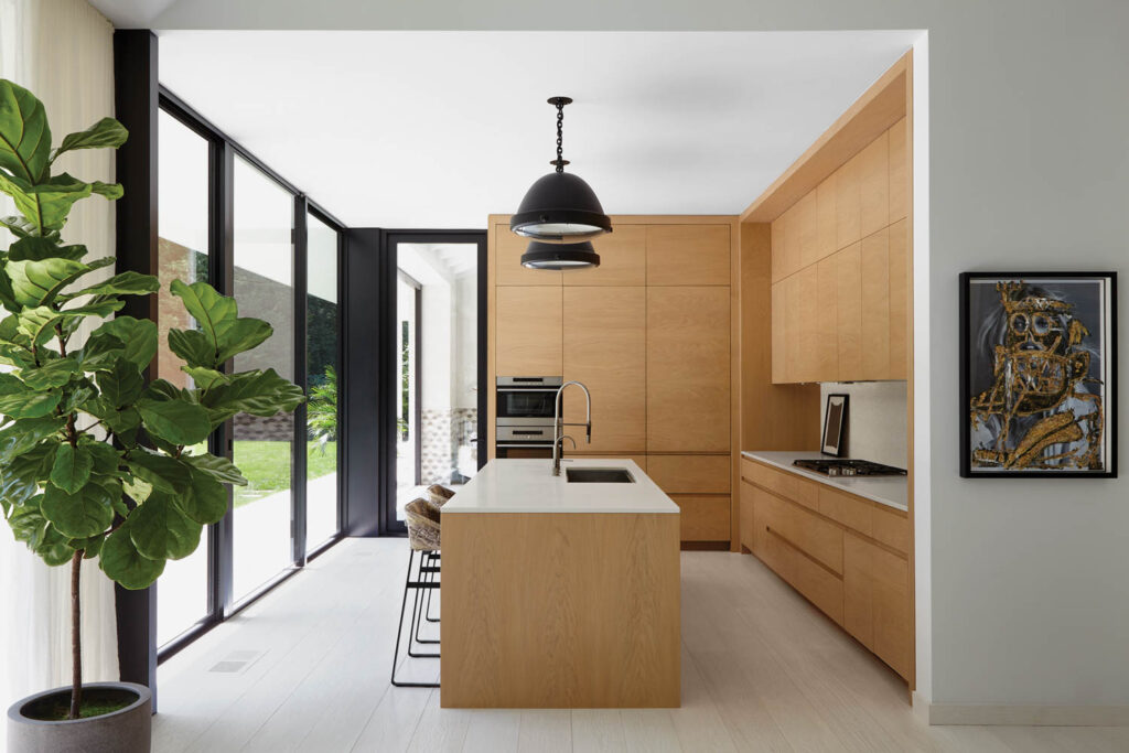 an open concept kitchen with custom oak cabinetry