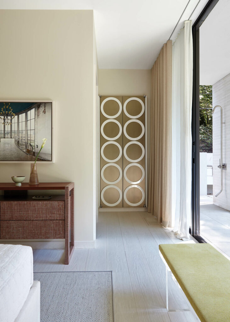 a gold-tinted stainless steel wardrobe's doors are covered in lacquered rings