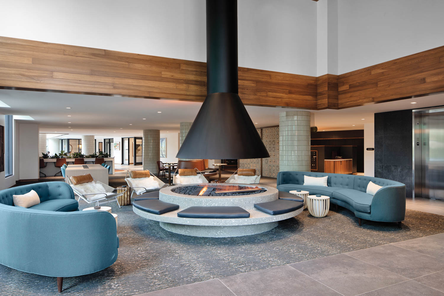 a concrete-slab fireplace in the lounge of a San Diego rental building