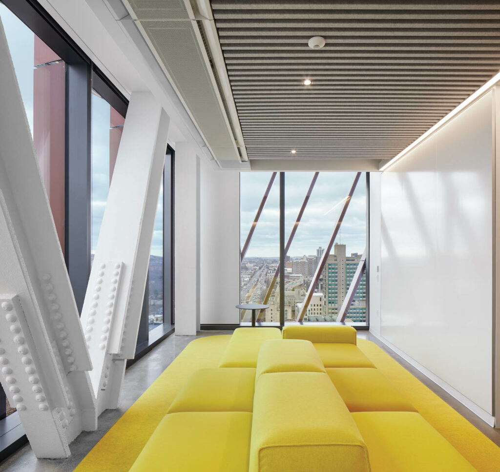 yellow modular sofas in a room with a writeable wall surface