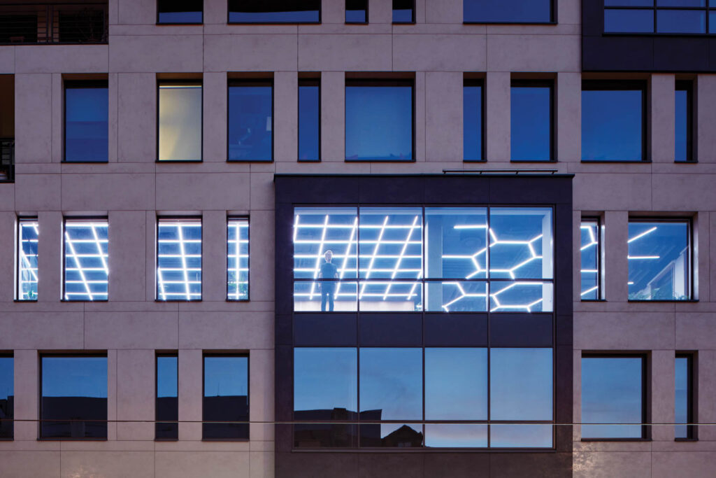 Inside Pricefx's office, LED ceiling grids are visible from the street