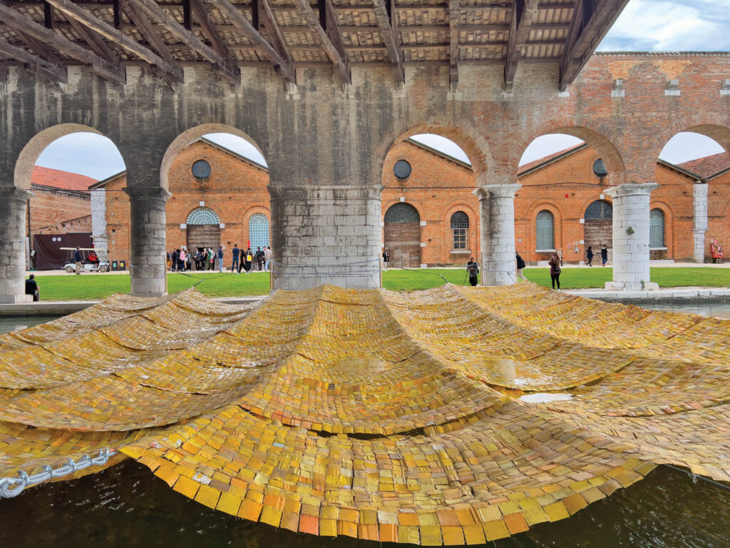 Time and Chance, an installation tapestry made from thousands of squares cut from plastic gallon containers