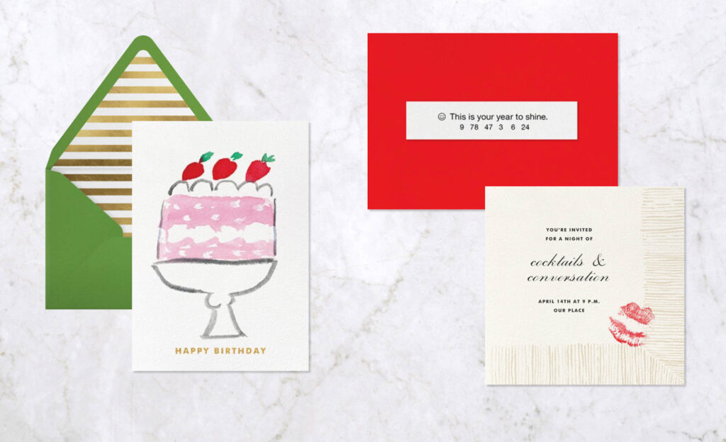 invitations by Paperless Post on a marble background