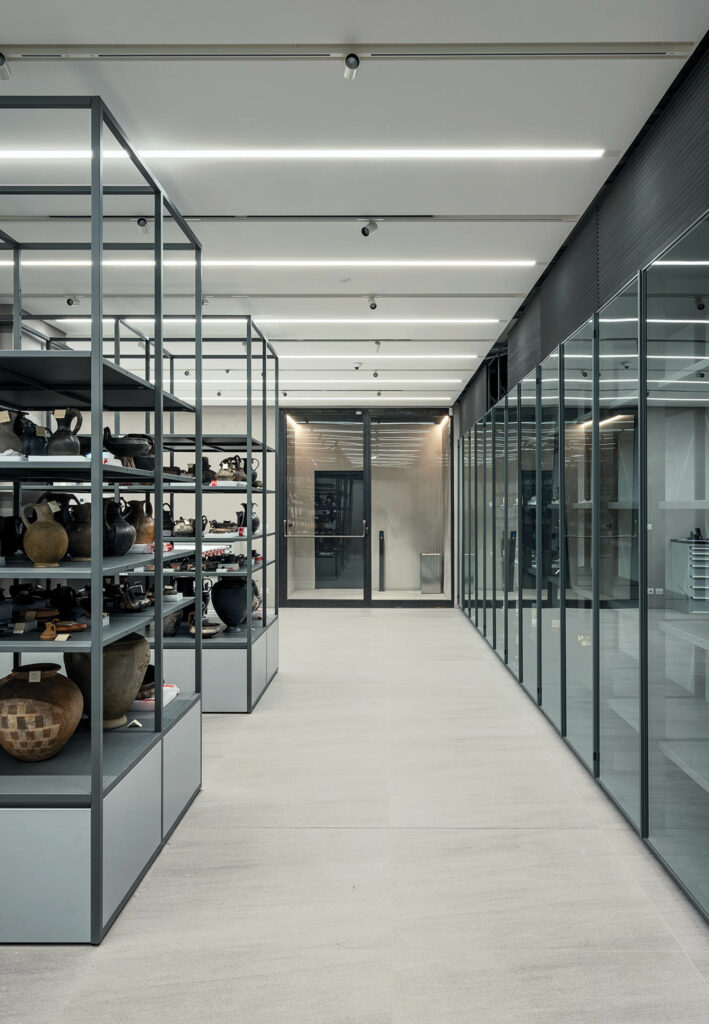 painted steel fixtures hold archival material at this museum