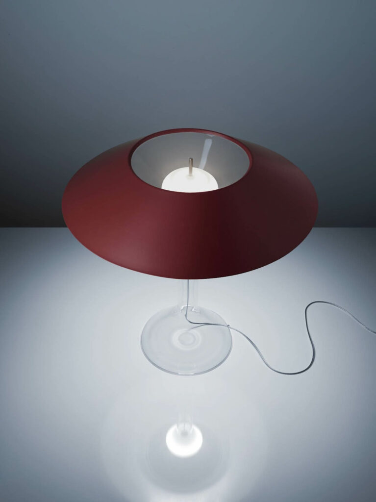 A burgundy table lamp by Rodolfo Dordoni