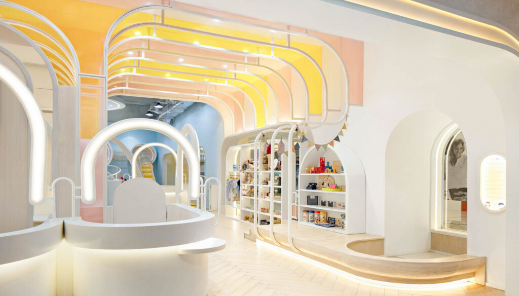 A white room with a pastel rainbow design on the ceiling