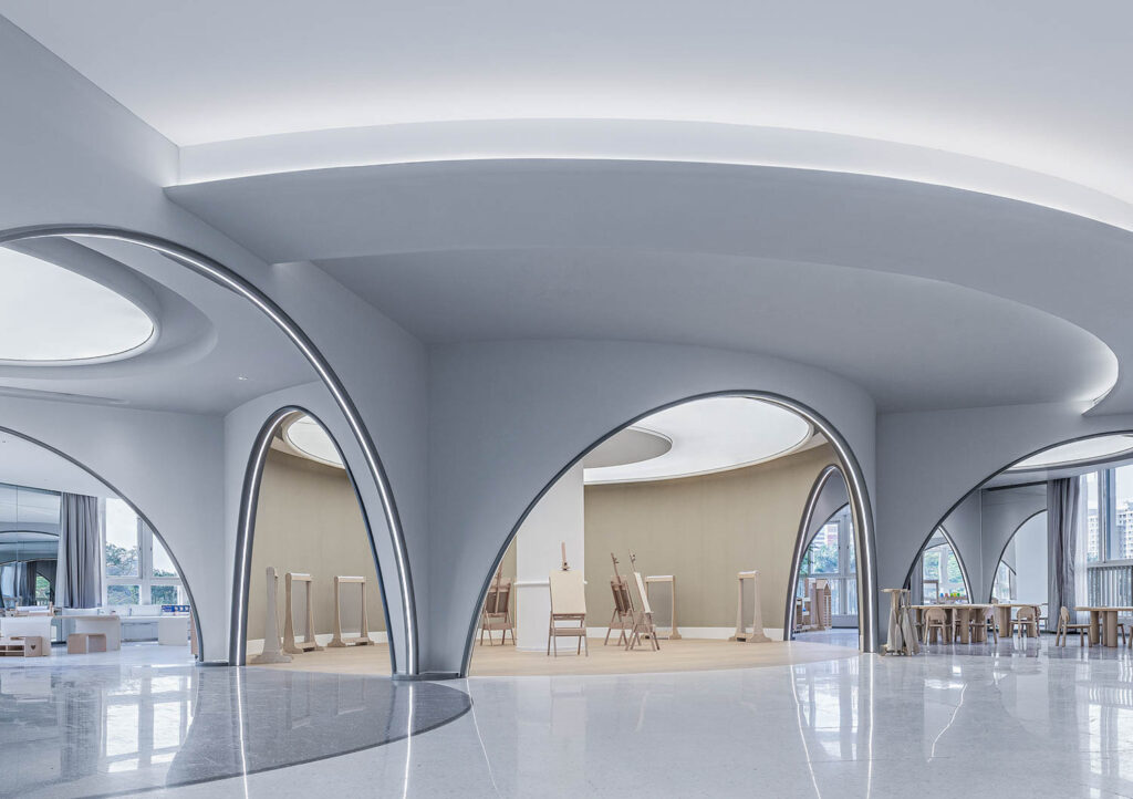 A flexible space for art with curved gray archways