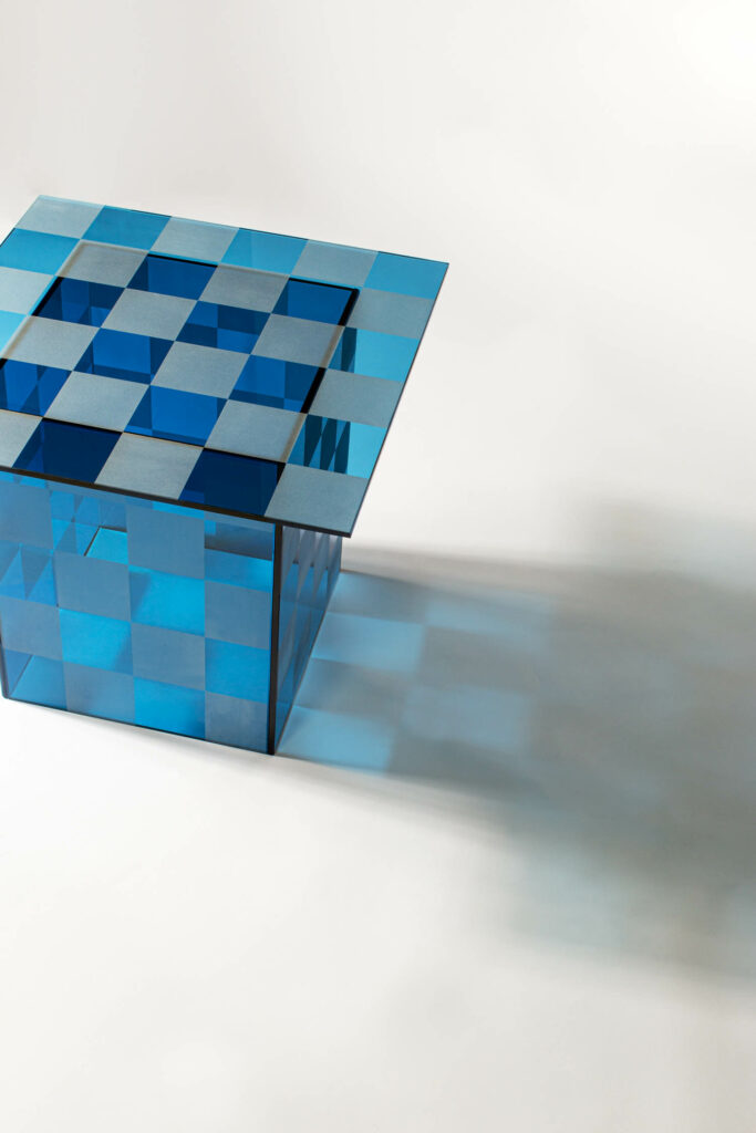 a checkerboard glass table by Pulpo