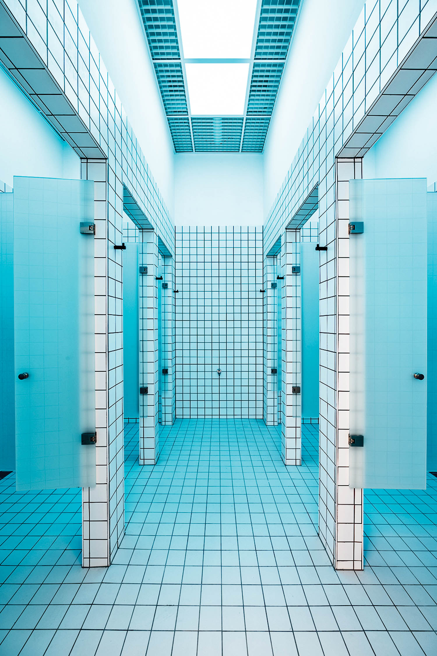 A teal shower area with tile in King Kong Club