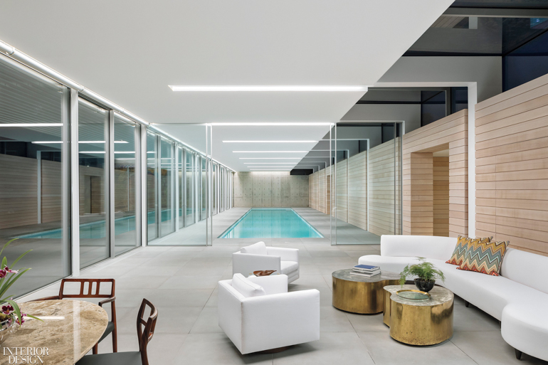 An inside pool near white furnishings