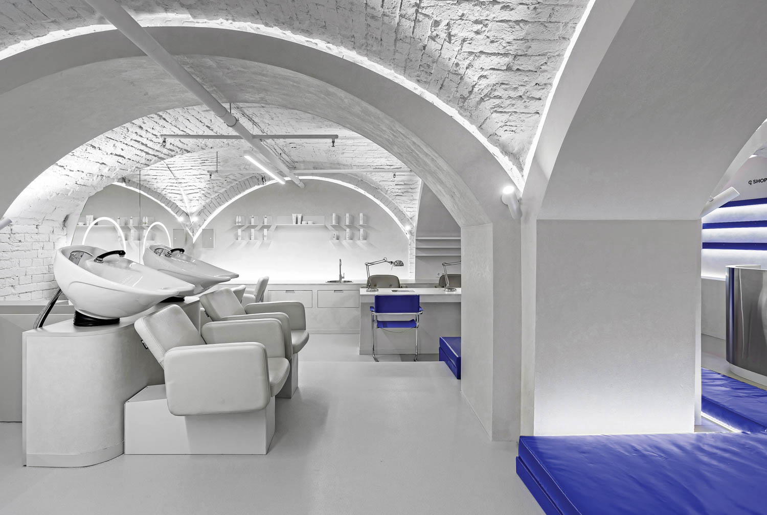 A gray room with arched ceiling