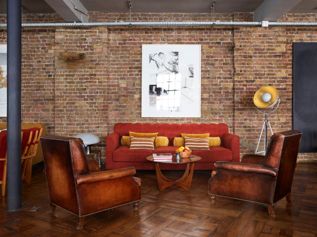 a vintage coffee table and leather chairs