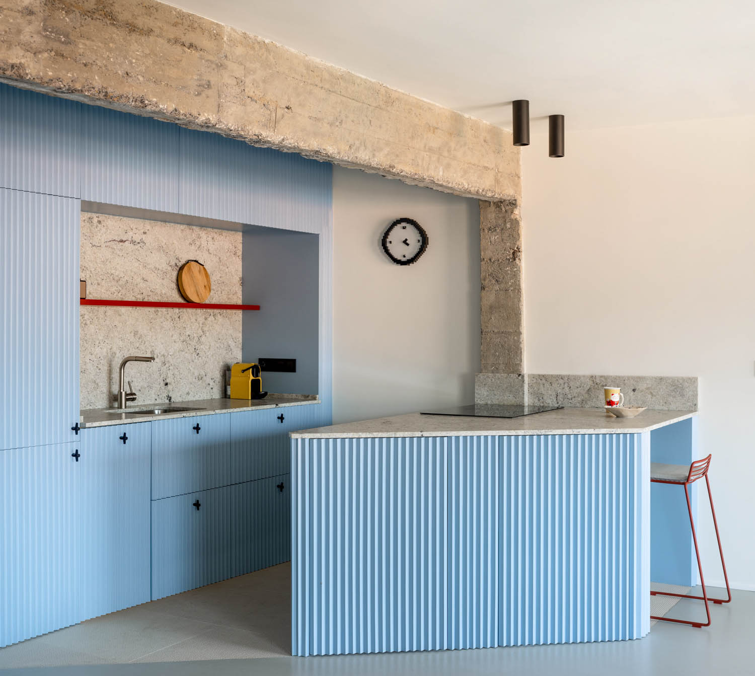 Blue kitchen with blue island with sink