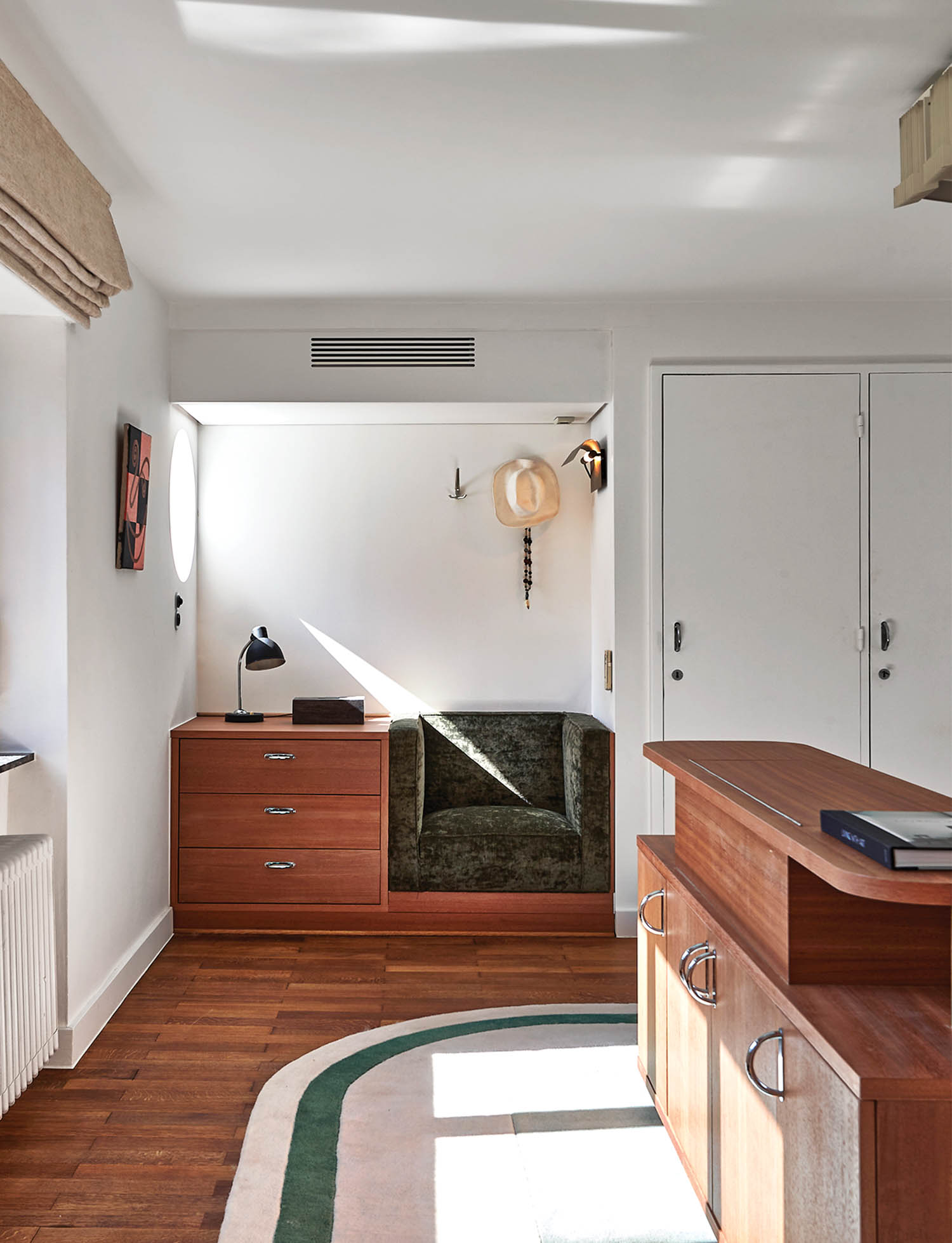 a built-in reading area and seating inside a 1930s home