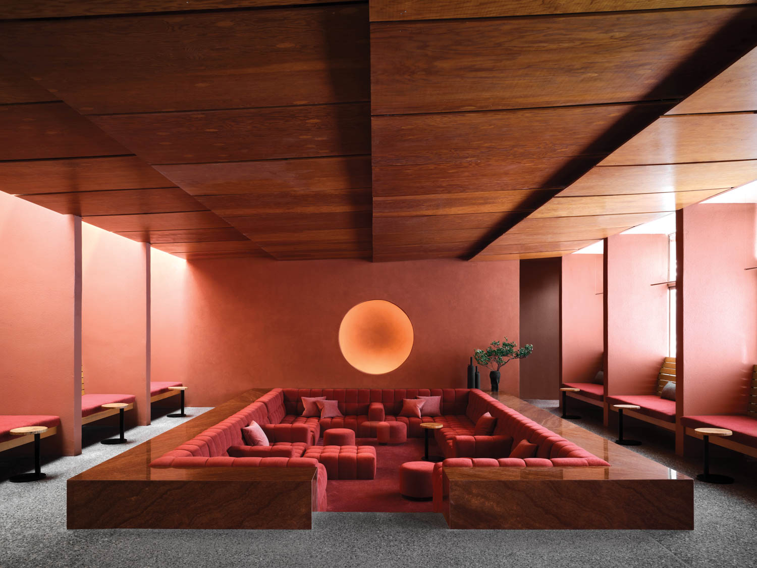 sunken seating in the living room of a resort spa in Arizona, in shades of red