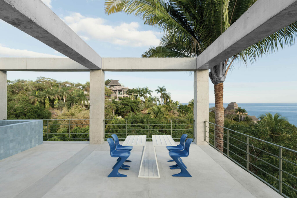 the rooftop of a boutique hotel overlaid with concrete beams