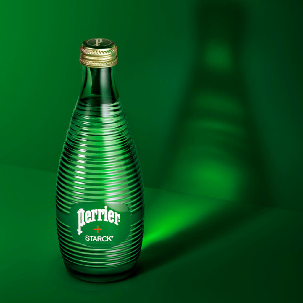 Green perrier water bottle on a green background