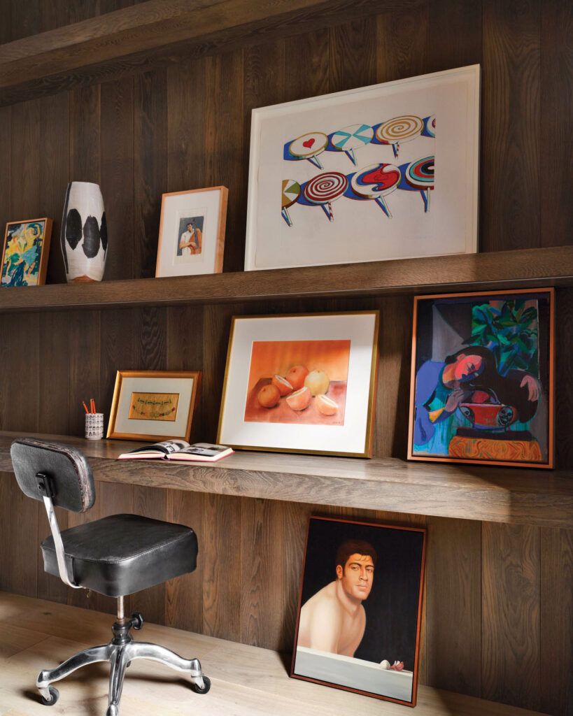 an office in the bedroom with a black chair