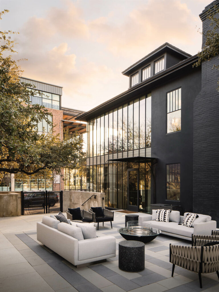 the black, moody exterior of venture capital firm 8VC in a former bungalow