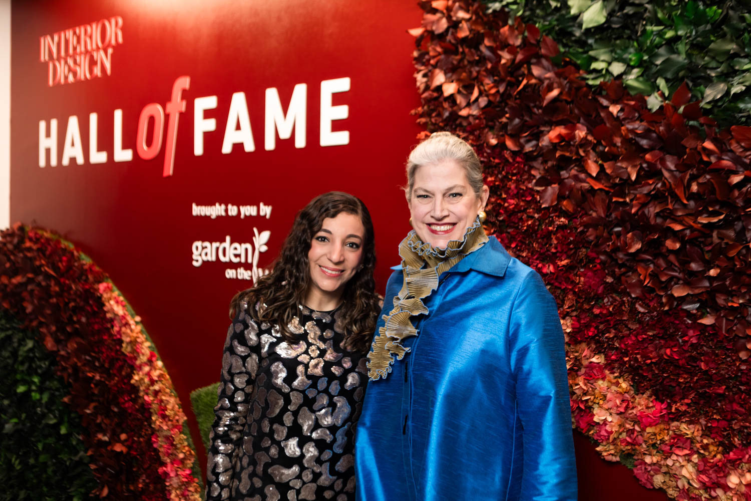 Hall of Fame attendees in front of the Garden on the Wall installation