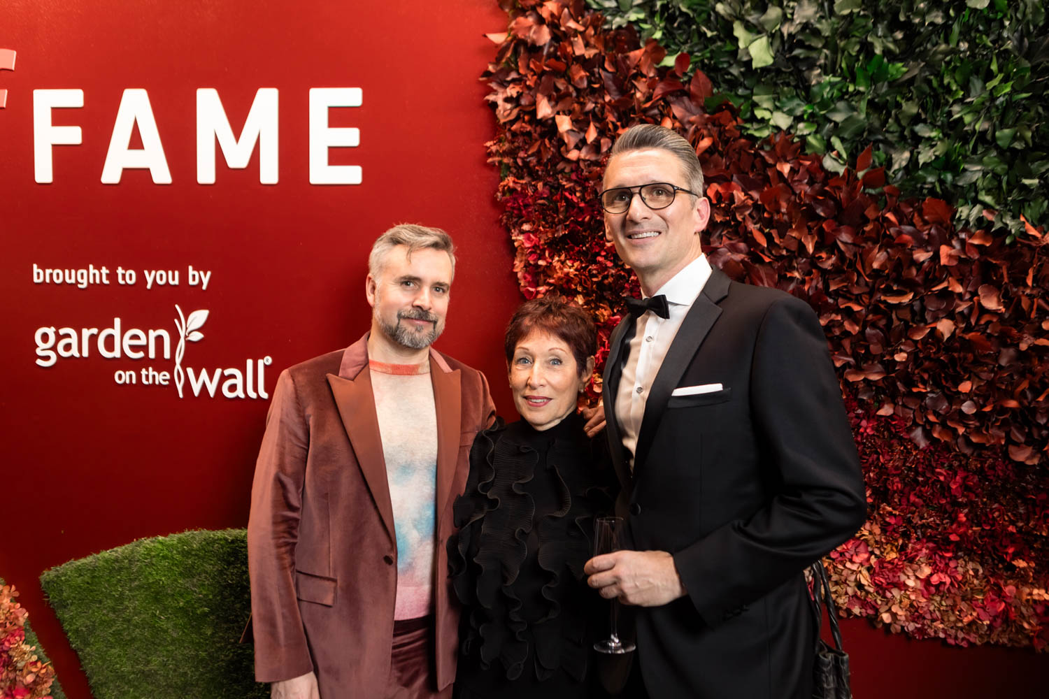 Hall of Fame attendees in front of the Garden on the Wall installation