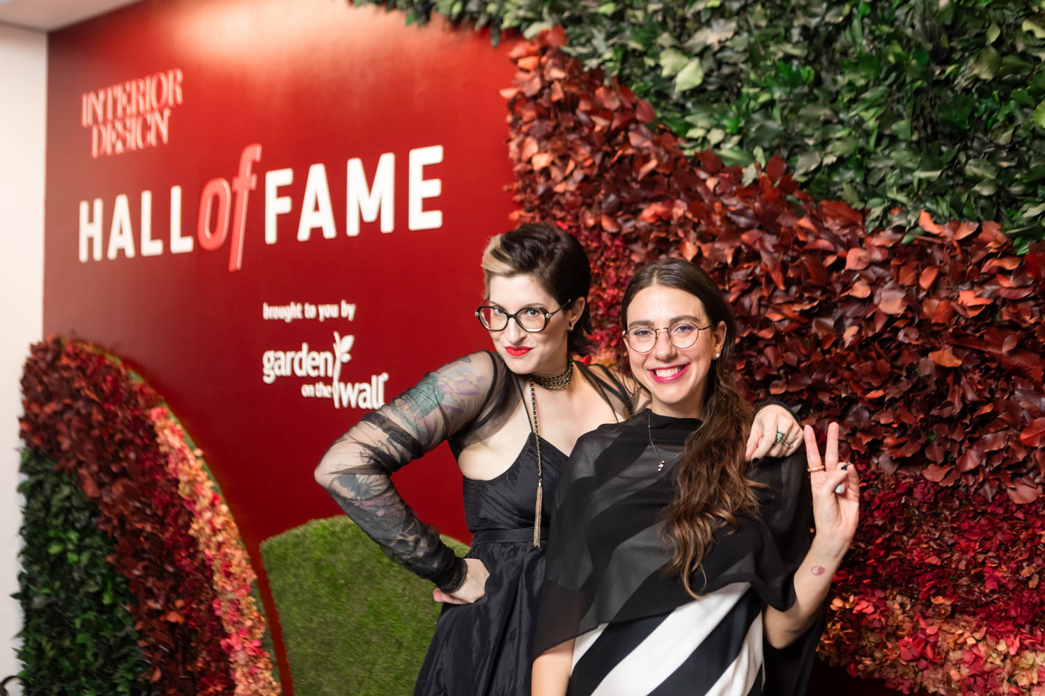 Hall of Fame attendees in front of the Garden on the Wall installation