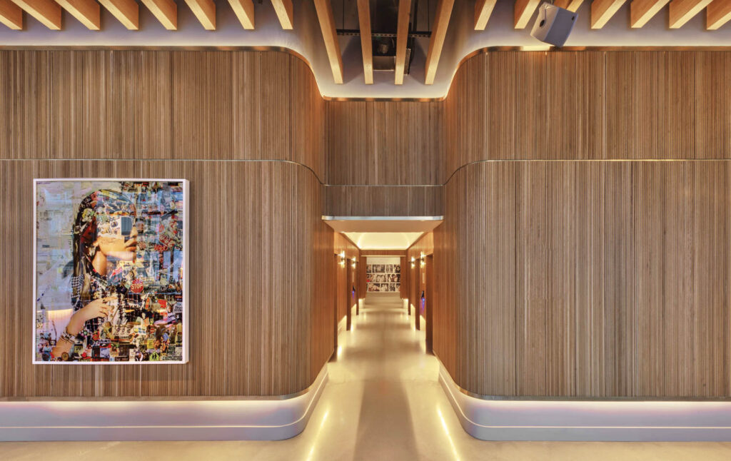 a gold hues hallway in virgin hotels