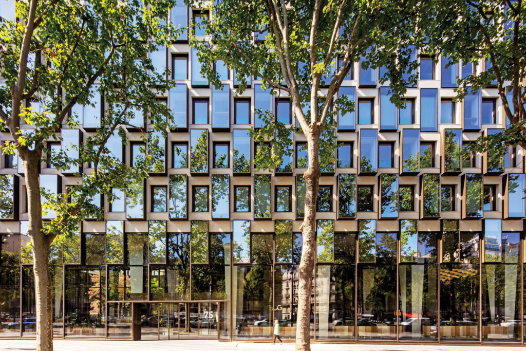 greenery wraps around this office building with mirrored windows