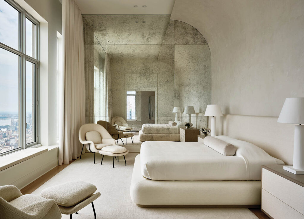 a white, airy bedroom in an apartment