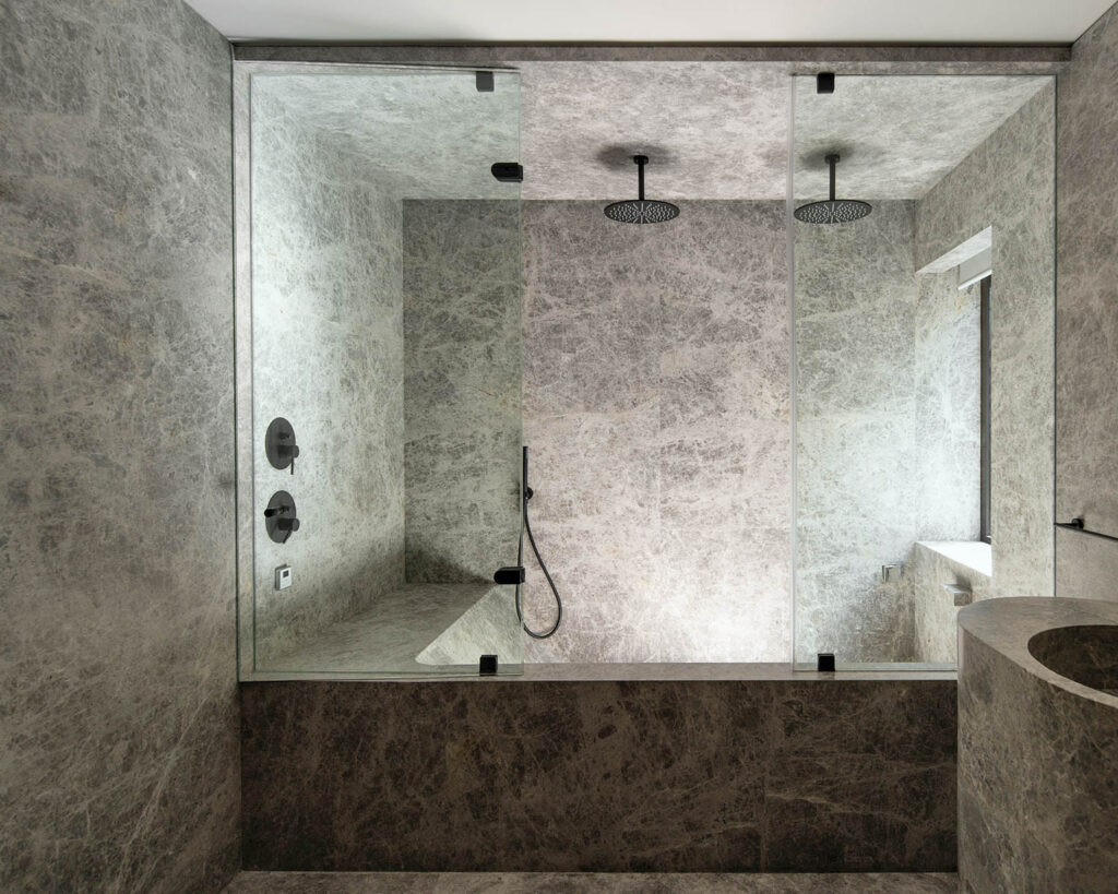 a spalike bathroom with a double rain shower head