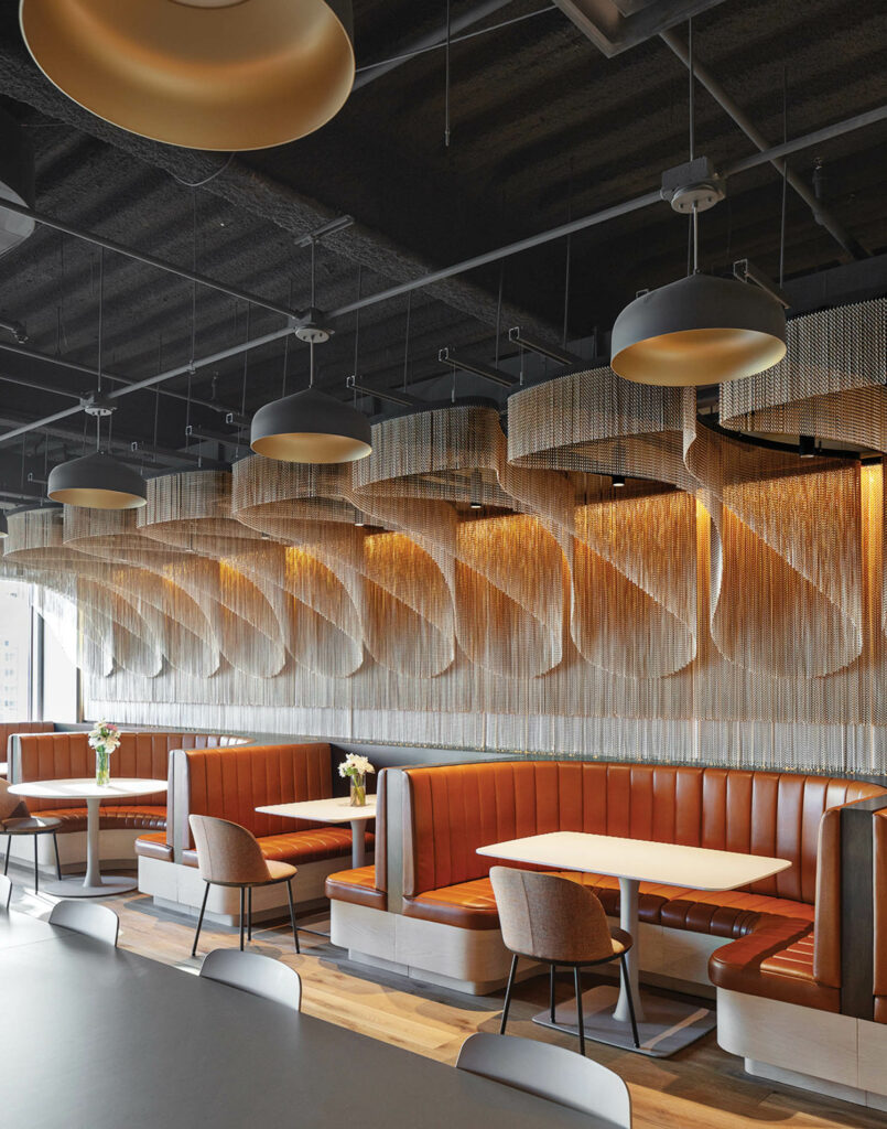 a cafe area with orange booths