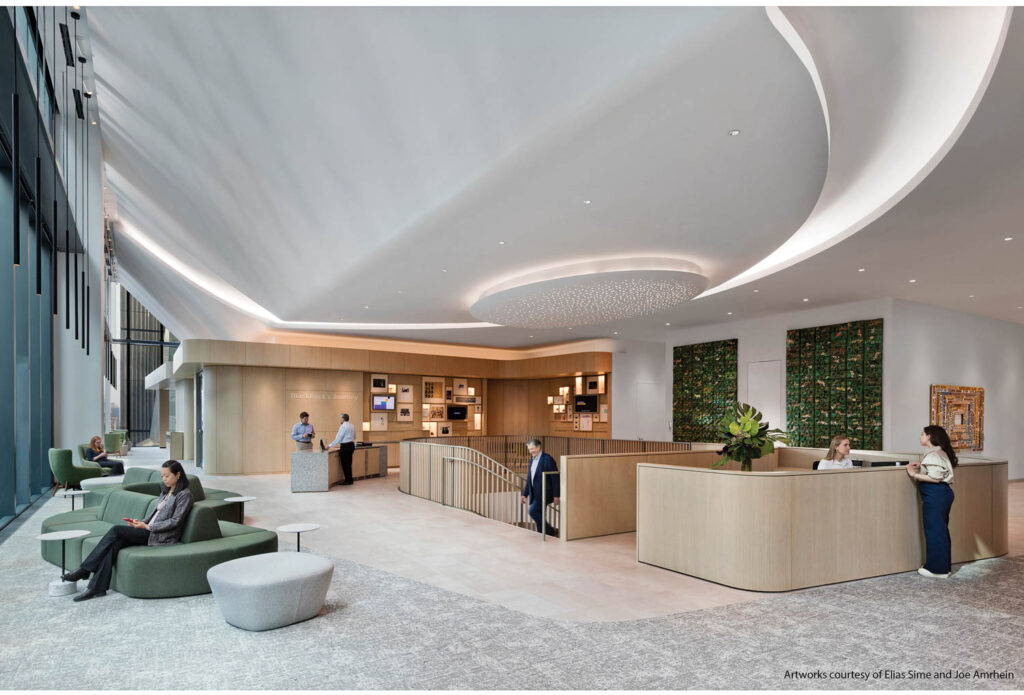 lobby of office with high ceilings and green chairs