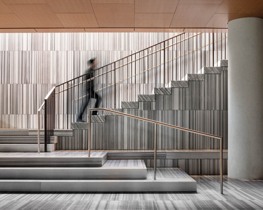 a staircase with gray flooring