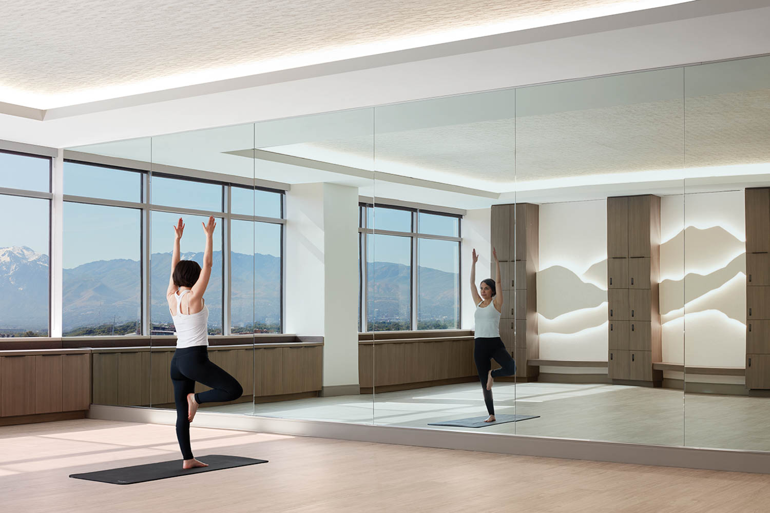 one person doing yoga in an empty studio