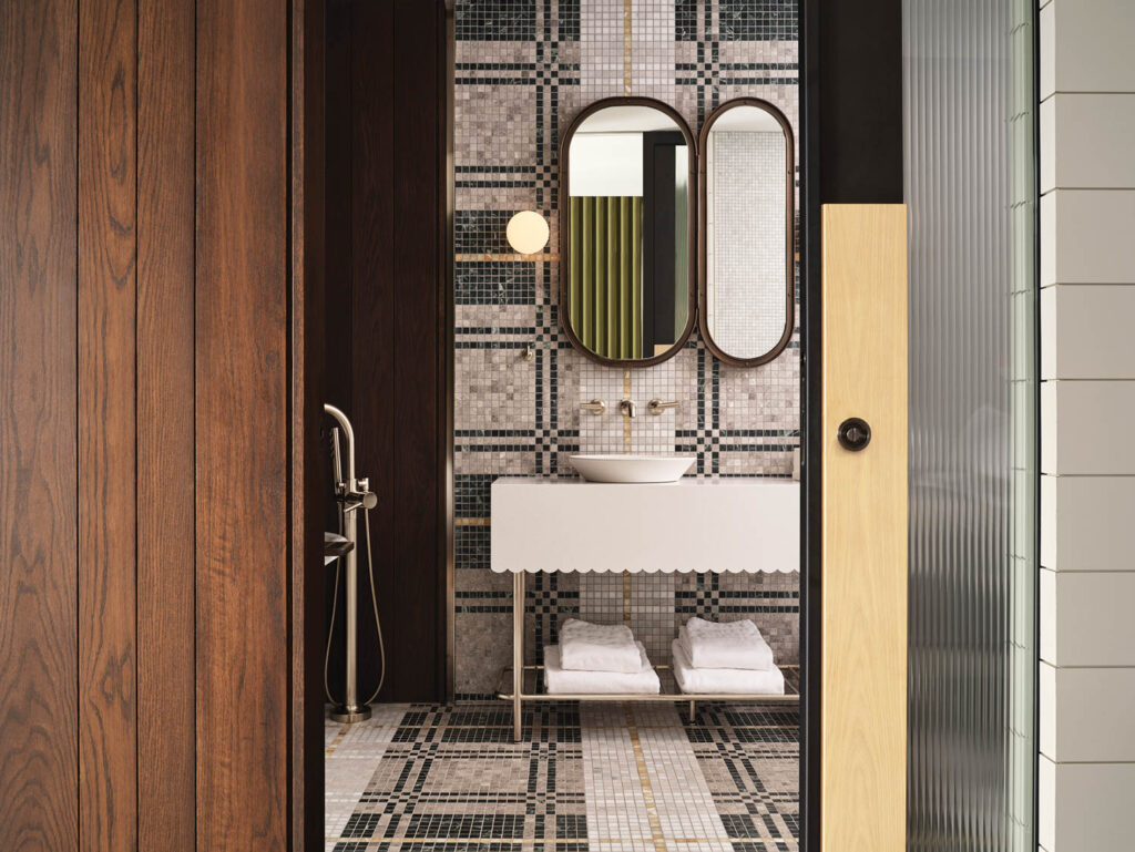 bathroom with oval mirrors and white sink