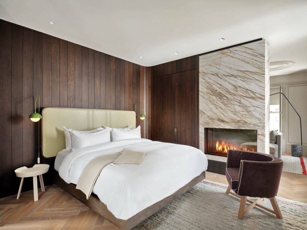 bedroom with wooden panels and marble walls