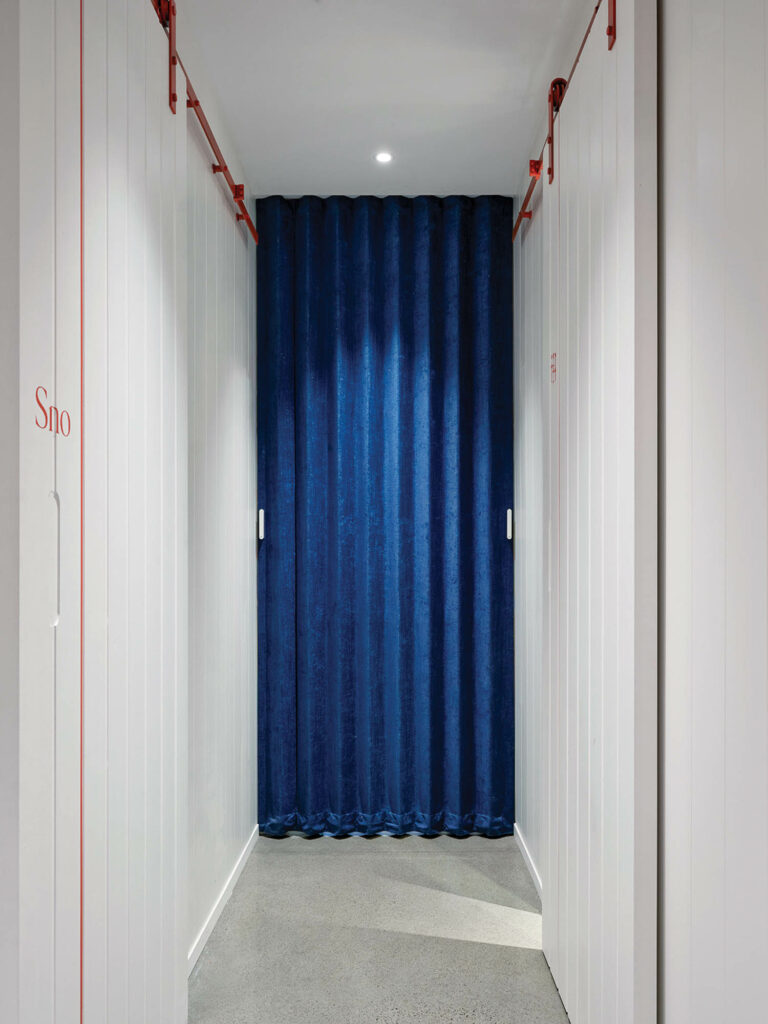 hallway with blue curtains