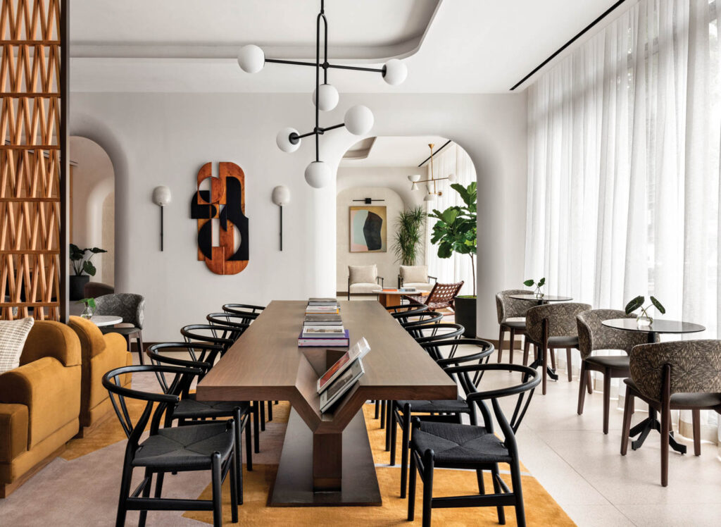 Dining room with long wooden table and multiple chairs