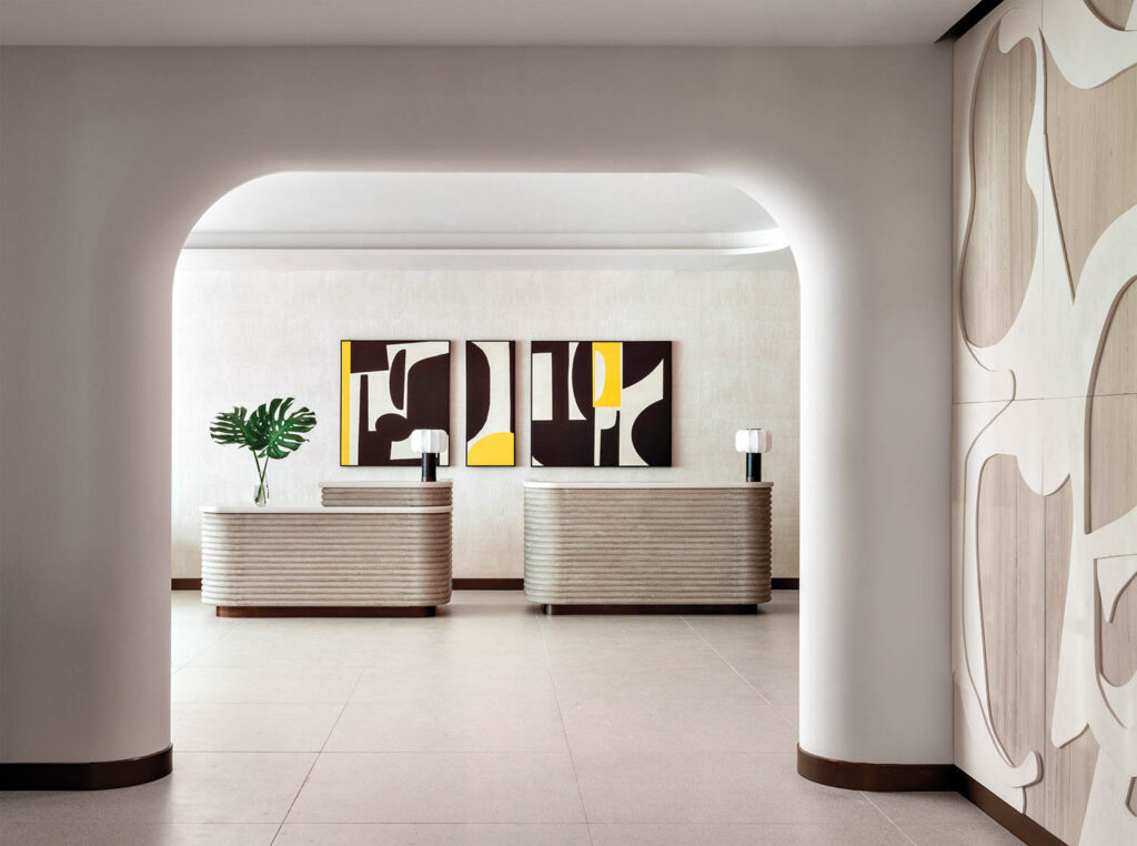 room with arched ceiling and view of reception desk and graphic artwork