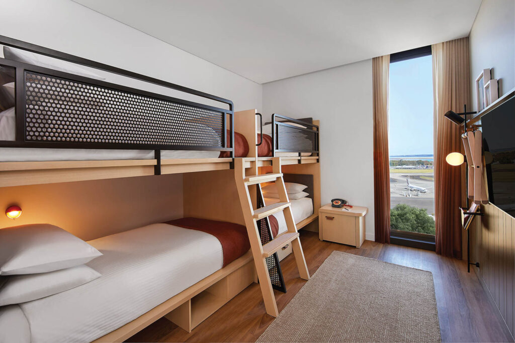 room with wooden bunk bed and view of scenery outside