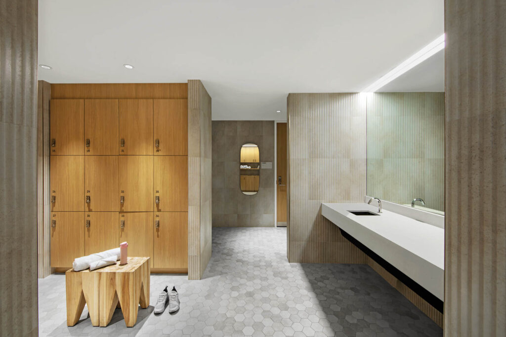 fitness center locker room with ceramic tiles and oak lockers