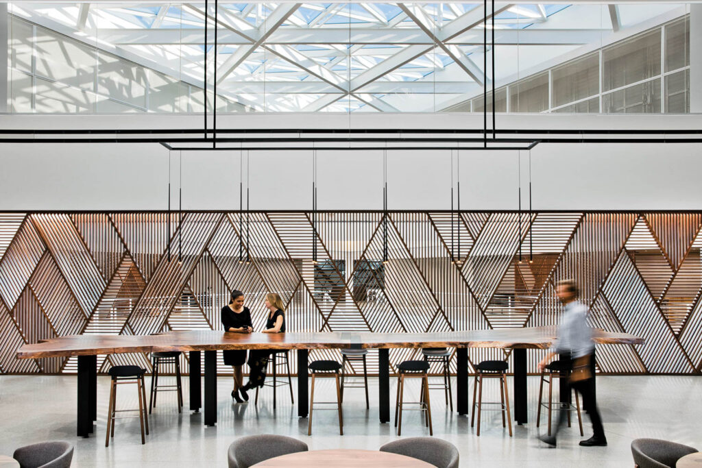 indoor dining space inside of airport with people sitting at tables