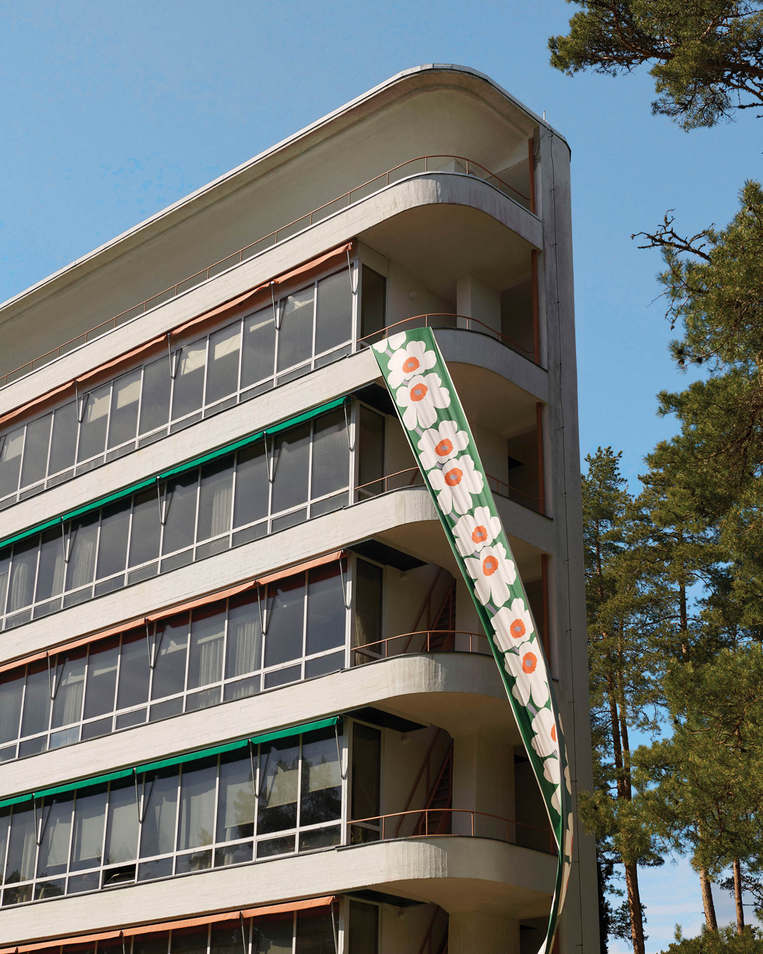 outside of office building with a flower banner