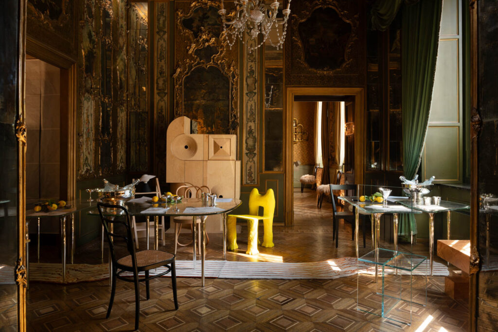 the dining room includes pops of color like a geometric yellow chair