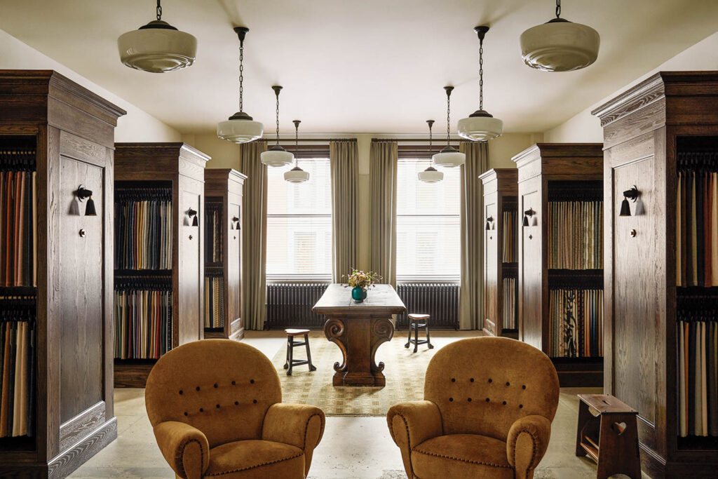 living room with tan chairs and lots of lights