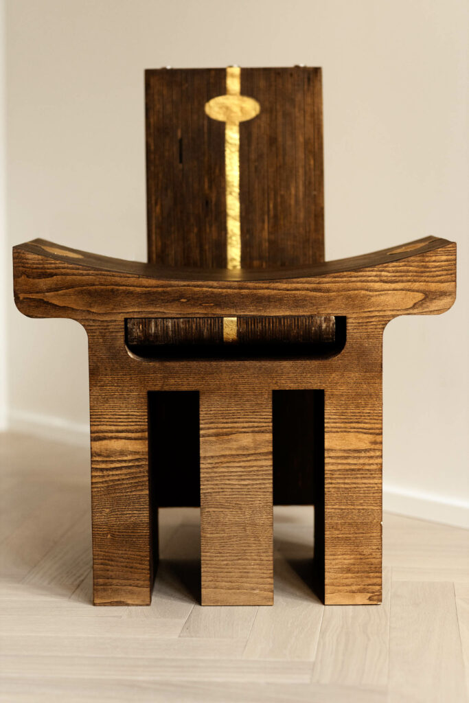 wooden chair with three legs as the base